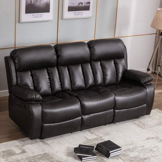 Dark brown leather three-seater recliner sofa with padded armrests and cushioned backrests featuring vertical stitching, placed on a light-coloured rug in a living room. Two photos hang above the sofa.
