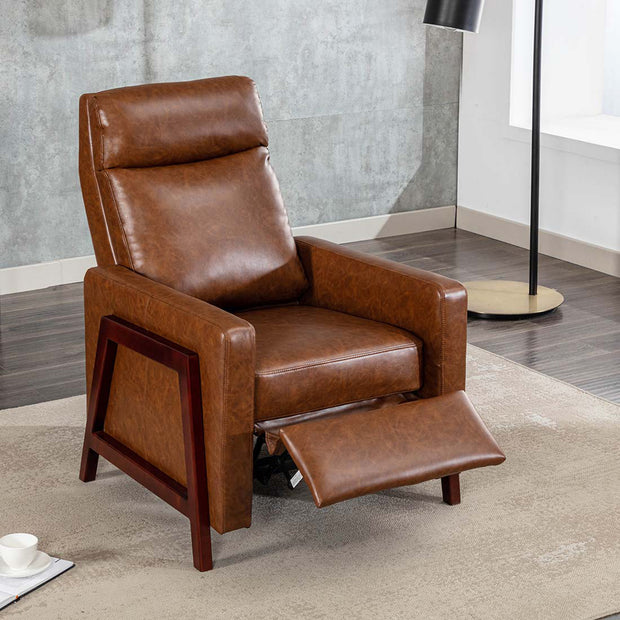 Brown leather push back recliner chair with a wooden frame, featuring a cushioned backrest and seat. The chair is partially reclined, set in a modern living room with wooden flooring and a beige rug.