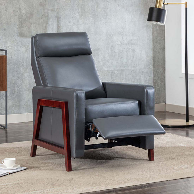 Grey leather push back recliner chair with a wooden frame, featuring a cushioned backrest and seat. The chair is partially reclined, set in a modern living room with wooden flooring.