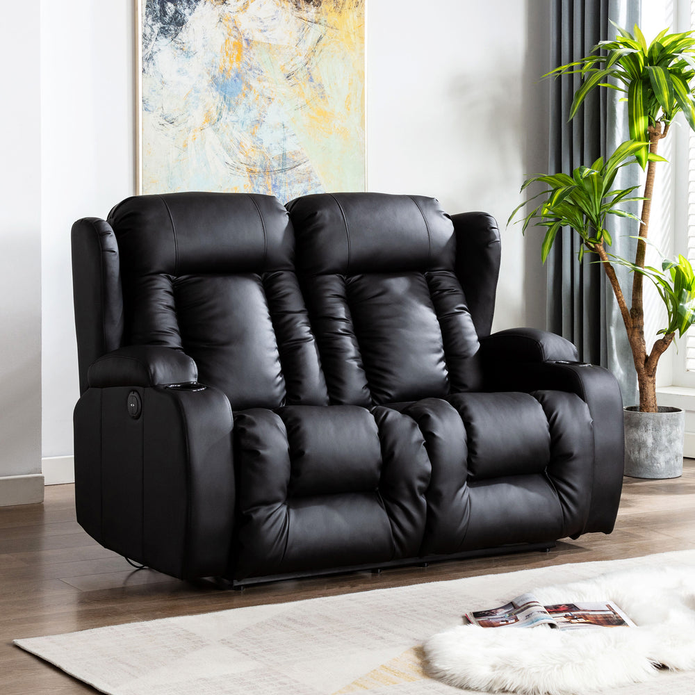 Black leather two-seater electric recliner sofa with both seats in an upright position, featuring cushioned backrests, cupholders, and side pockets, set in a living room with wooden flooring and abstract wall art.