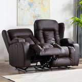 Dark brown leather two-seater manual recliner sofa with one seat fully reclined, featuring cushioned backrests and cupholders, set in a living room with wooden flooring, a white rug, and abstract wall art.