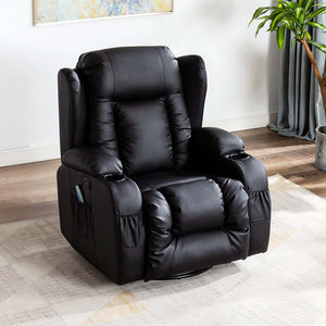 Black leather manual recliner with a cushioned backrest featuring vertical stitching, padded armrests, cup holders, and front and side pockets, set in a living room with an abstract painting hung on the wall above the chair. 