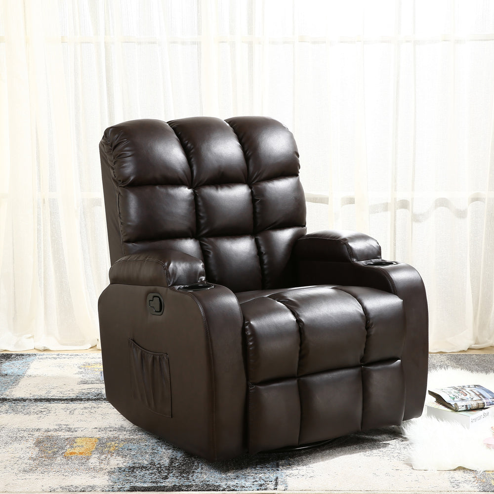 Dark brown leather manual recliner with tufted backrest, cup holders, and a side pocket, set in a living room with light curtains and a patterned rug. A book and a magazine rest on the floor nearby.