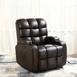 Dark brown leather manual recliner with tufted backrest, cup holders, and a side pocket, set in a living room with light curtains and a patterned rug. A book and a magazine rest on the floor nearby.