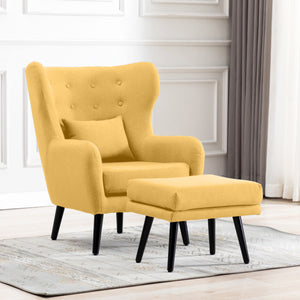Yellow linen accent wingback chair with tufted buttons, paired with a matching footstool, set on a grey patterned rug against a white panelled wall.