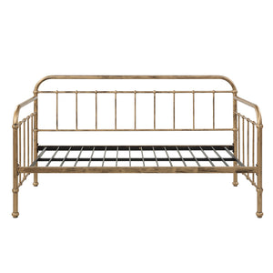 A brass-coloured metal bed frame against a plain white backdrop. 