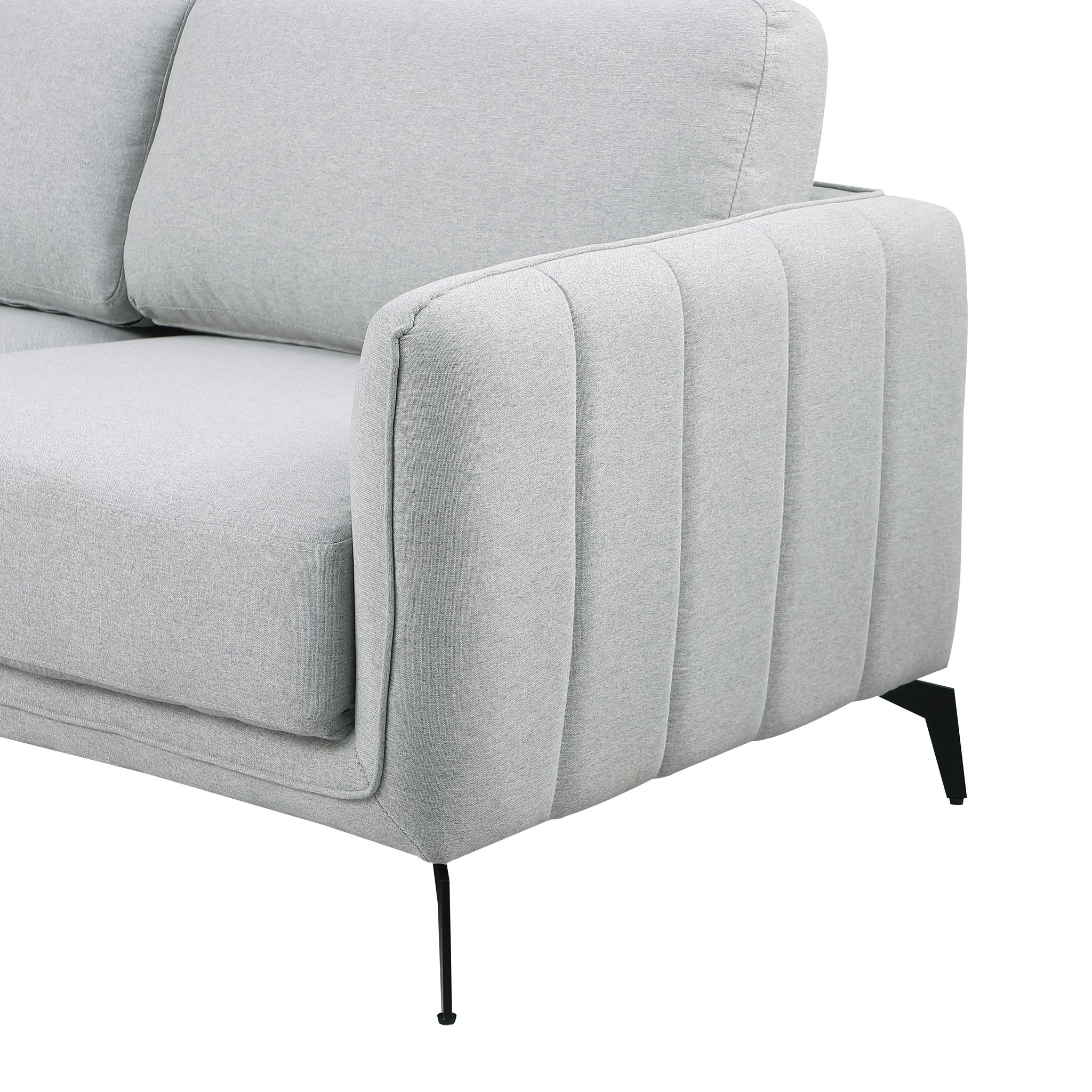 Close-up of a light grey fabric sofa with black legs set against a white backdrop. The armrest features vertical stitching details.