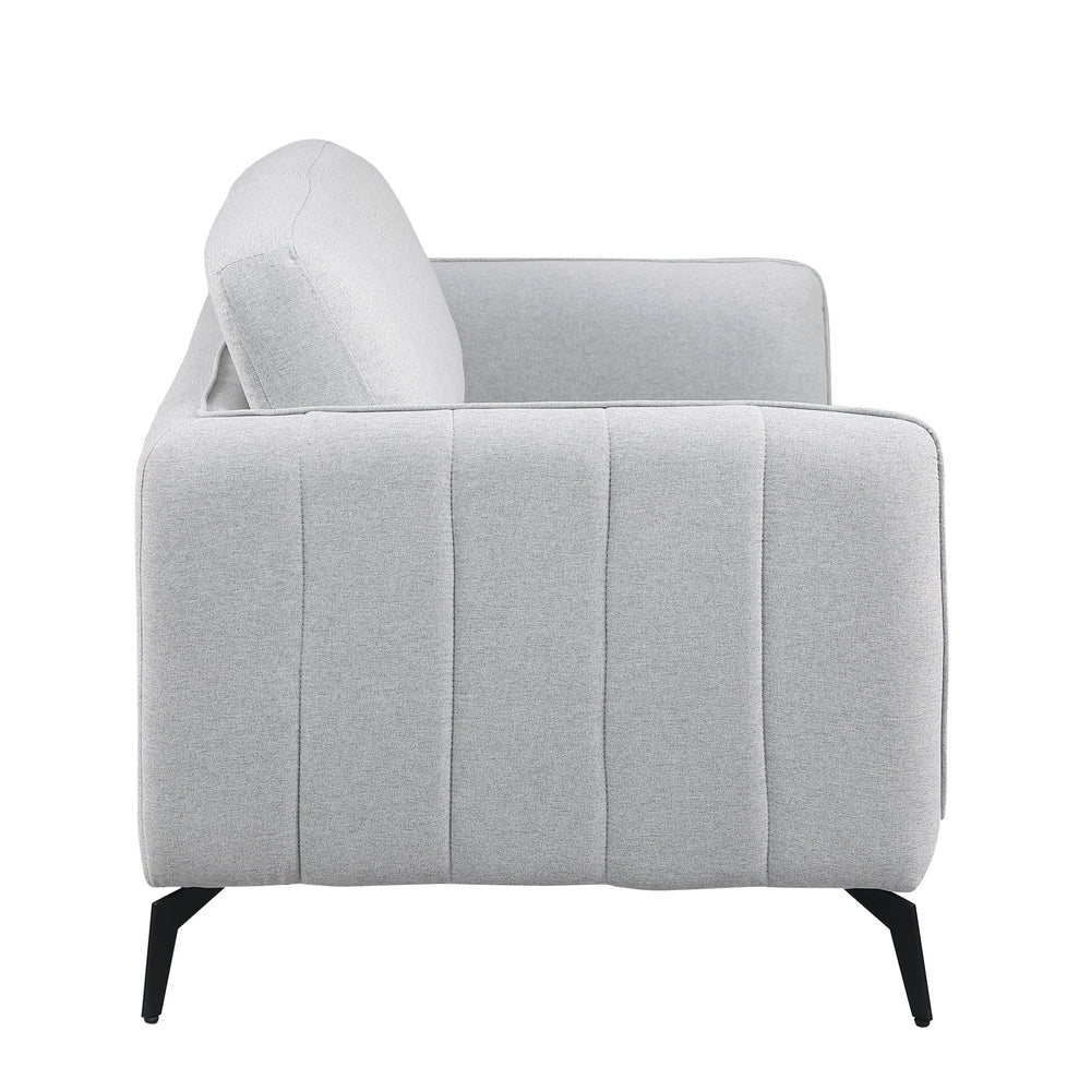Side view of a light grey fabric sofa with black legs set against a white backdrop. The armrest features vertical stitching details.