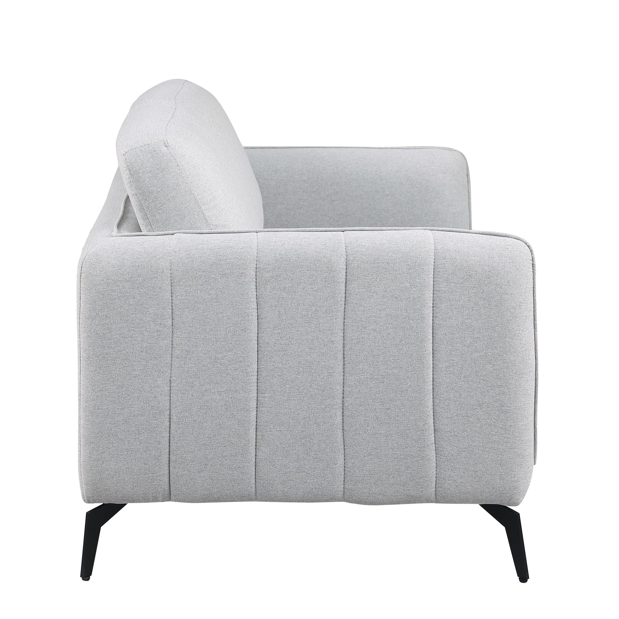 Side view of a light grey fabric sofa with black legs set against a white backdrop. The armrest features vertical stitching details.