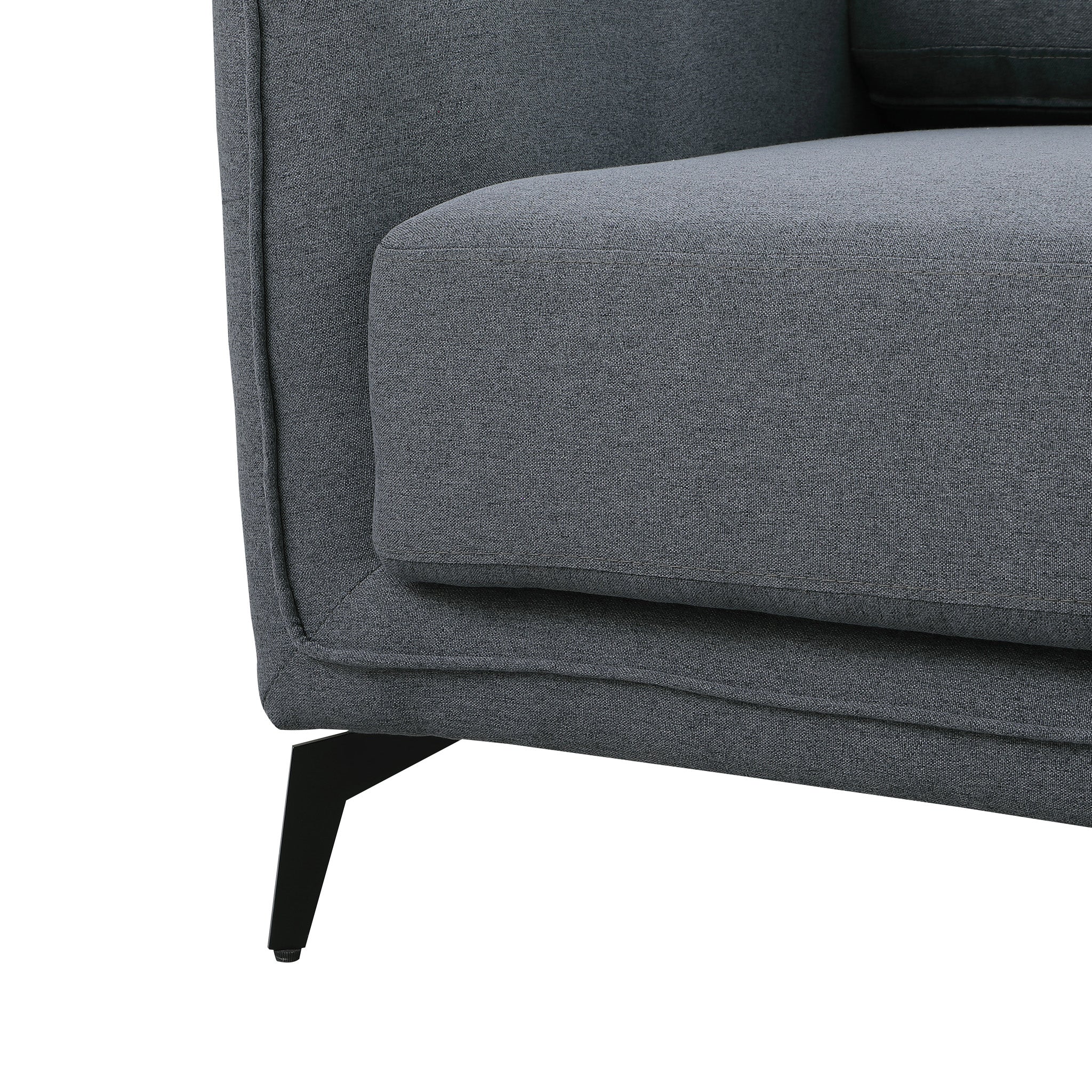 Close-up of a dark grey fabric sofa with black metal legs.