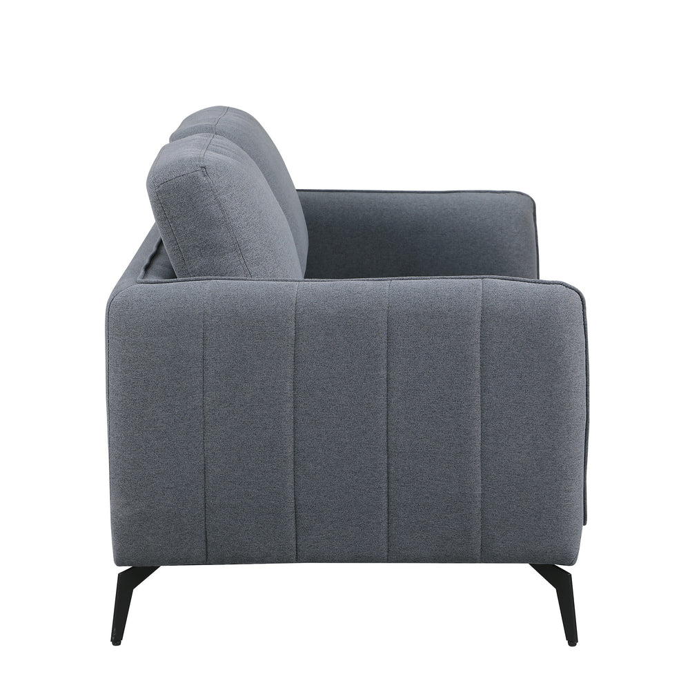 Side view of a dark grey fabric sofa with black legs set against a white backdrop. The armrest features vertical stitching details.