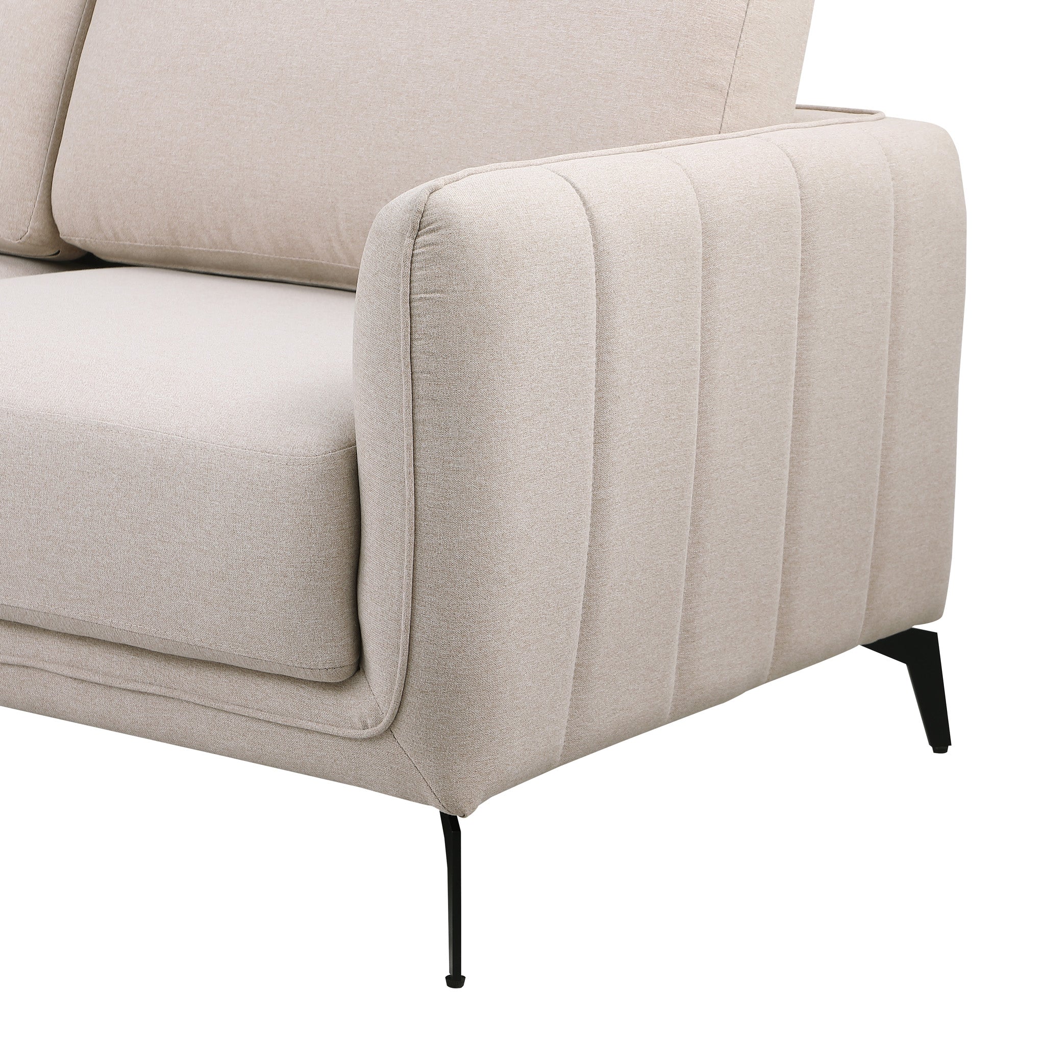 Close-up of a beige fabric sofa with black legs set against a white backdrop. The armrest features vertical stitching details.