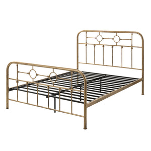 Brass-coloured metal bed frame with circular designs and vertical bars on the headboard and footboard against a plain white background.